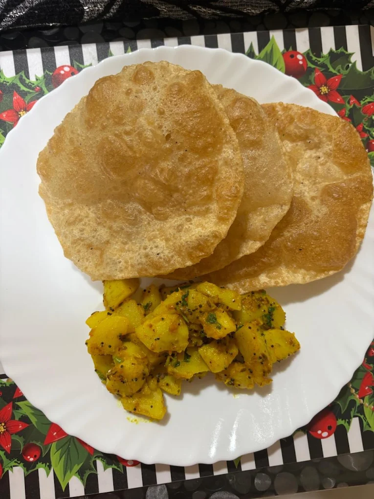 Fresh poori with aloo sabzi, home-cooked